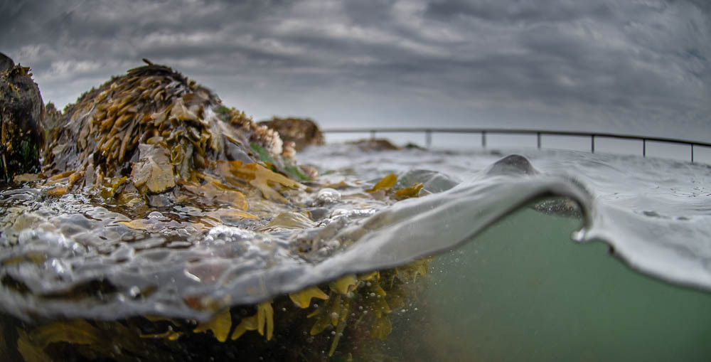 UNDER DEN UENDELIGE UNDER DEN UENDELIGE